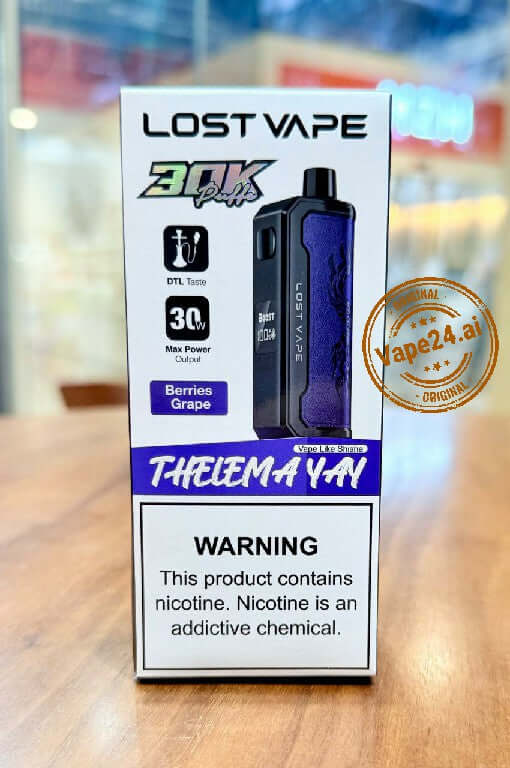 Lost Vape Thelema YAY 30K Puffs Disposable Vape packaging showing DTL Tasty, Berries Grape flavor, and warning.