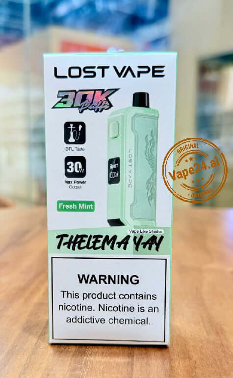 Lost Vape Thelema YAY 30K Puffs Disposable Vape in Fresh Mint flavor, highlighting product features and warning.