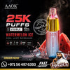 AAOK Watermelon Ice disposable vape device shown in a promotional graphic with red watermelon slices, steam effects, and multiple text overlays including '25K Puffs', '10ML Capacity', and 'Watermelon Ice'. A Vape24.