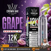 Promotional graphic for Crown Bar Al Fakher Crystal V2 Grape disposable vape and its packaging, featuring a silver and black device, a black box, grape imagery, and large text reading 'Grape', '12K Puffs', and 'Crystal V2'.