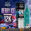 Crown Bar Alfakher Crystal V2 Berry Ice disposable vape device and its packaging box, displayed alongside fresh berries and ice on a dark blue background with promotional text.