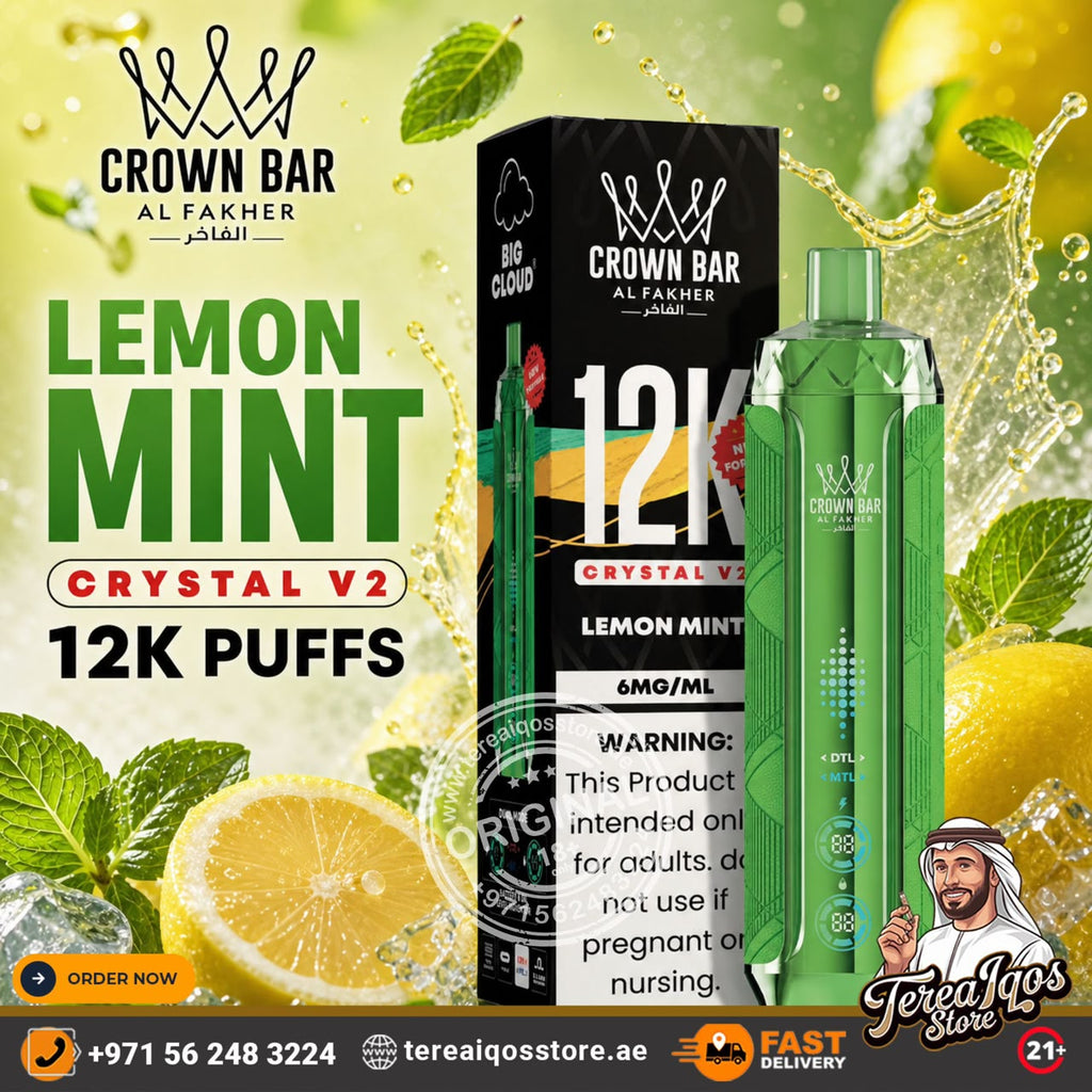 Promotional graphic for a Crown Bar Al Fakher Crystal V2 Lemon Mint disposable vape device and its packaging, shown alongside lemons, mint leaves, and water splashes on a bright green background.