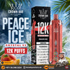 Promotional product graphic for Crown Bar Al Fakher Peace Ice Crystal V2 disposable vape. The image shows the black retail box, a metallic peach-pink vape device, large 'PEACE ICE' text, 'CRYSTAL V2 12K PUFFS' callouts, tropical ice and peach imagery, and store branding at the bottom.