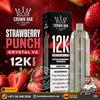 Crown Bar Al Fakher Crystal V2 Strawberry Punch disposable vape device next to its black packaging box, set against a dark red background decorated with fresh strawberries and promotional text.