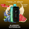 Tesla Bar vape device with blueberry and watermelon flavor elements on a brown background