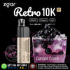 Zgar Retro 10K vape device with a glass of Currant Crush drink on a black background