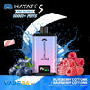 Hayati Pro Ultra+ vape device with blueberries, raspberries, and a pink candy on a black background.