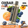 OXBAR Shisha 6 MG Peach Berry disposable vape device with a gold and black body, surrounded by peach slices, blueberries, and blackberries on a white background with promotional text and a Vape24.Ai logo.